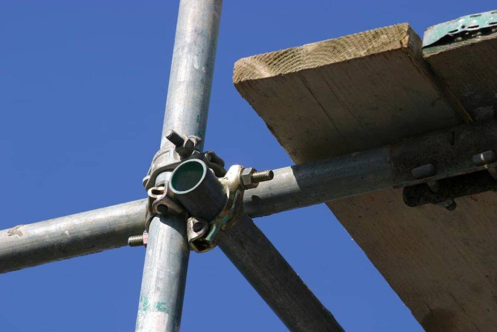 Close Up Of Scaffold Poles Joined At Corner