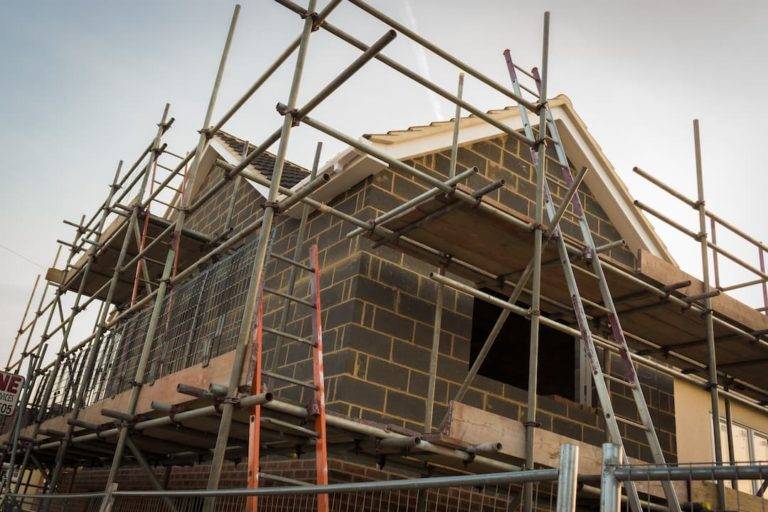 House Under Construction With Scaffolding Up