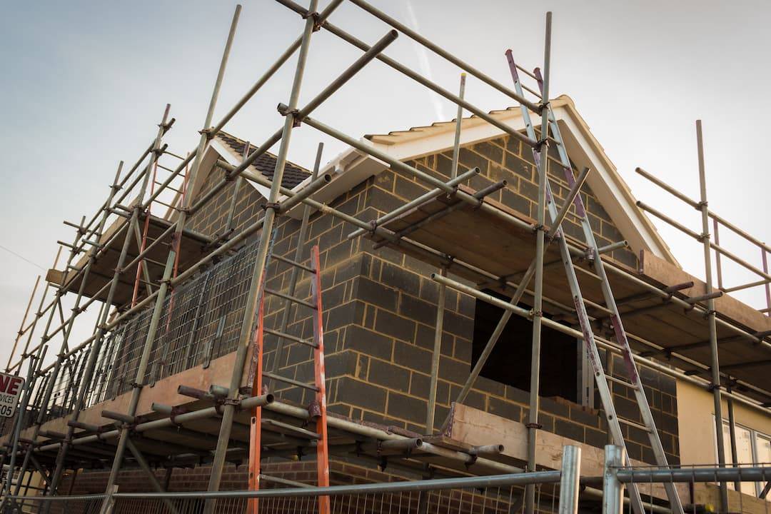 House Under Construction With Scaffolding Up